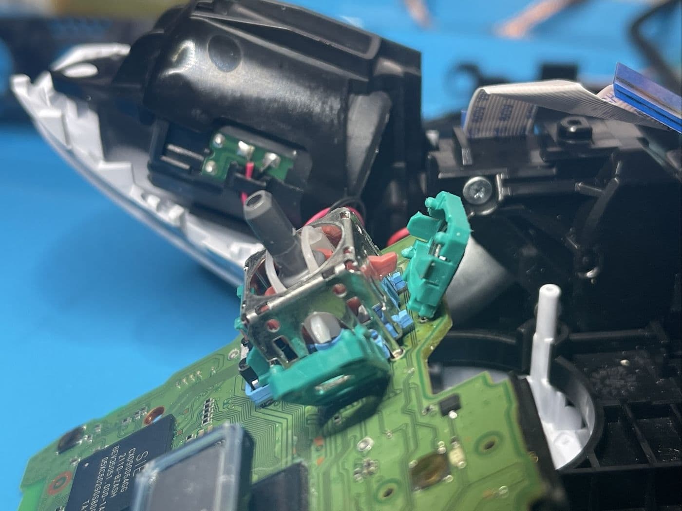 The inside of a games controller with the thumbstick modules exposed