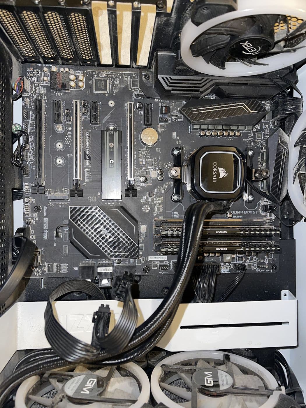 A desktop motherboard with a liquid cooler fitted